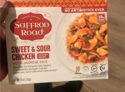 Saffron Road Sweet & Sour Chicken With Jasmine Rice Bok Choy, Red And Green Bell Peppers In A Masterful Pineapple & Ginger Sweet-Sour Sauce With White Meat Chicken packaging